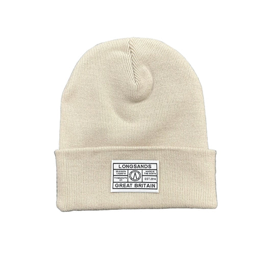 Almond knit beanie with a label