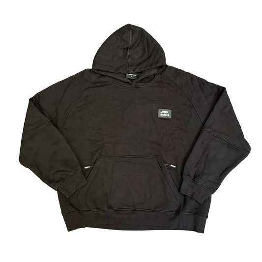 Black hoodie with a logo on a wooden floor